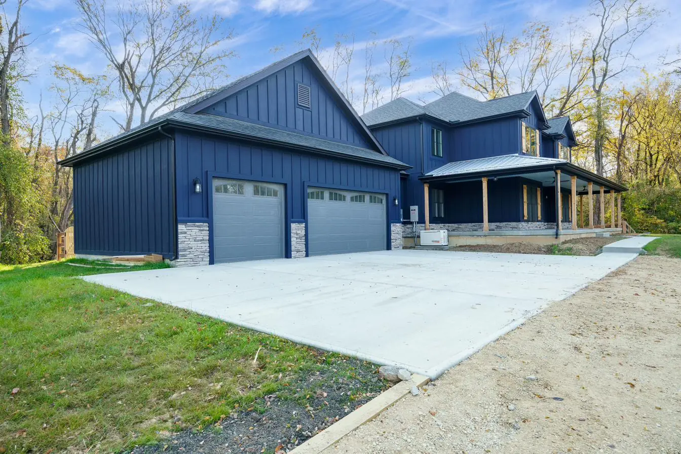 Completed ACE Homes custom home on a wooded rural parcel in Southwest Ohio